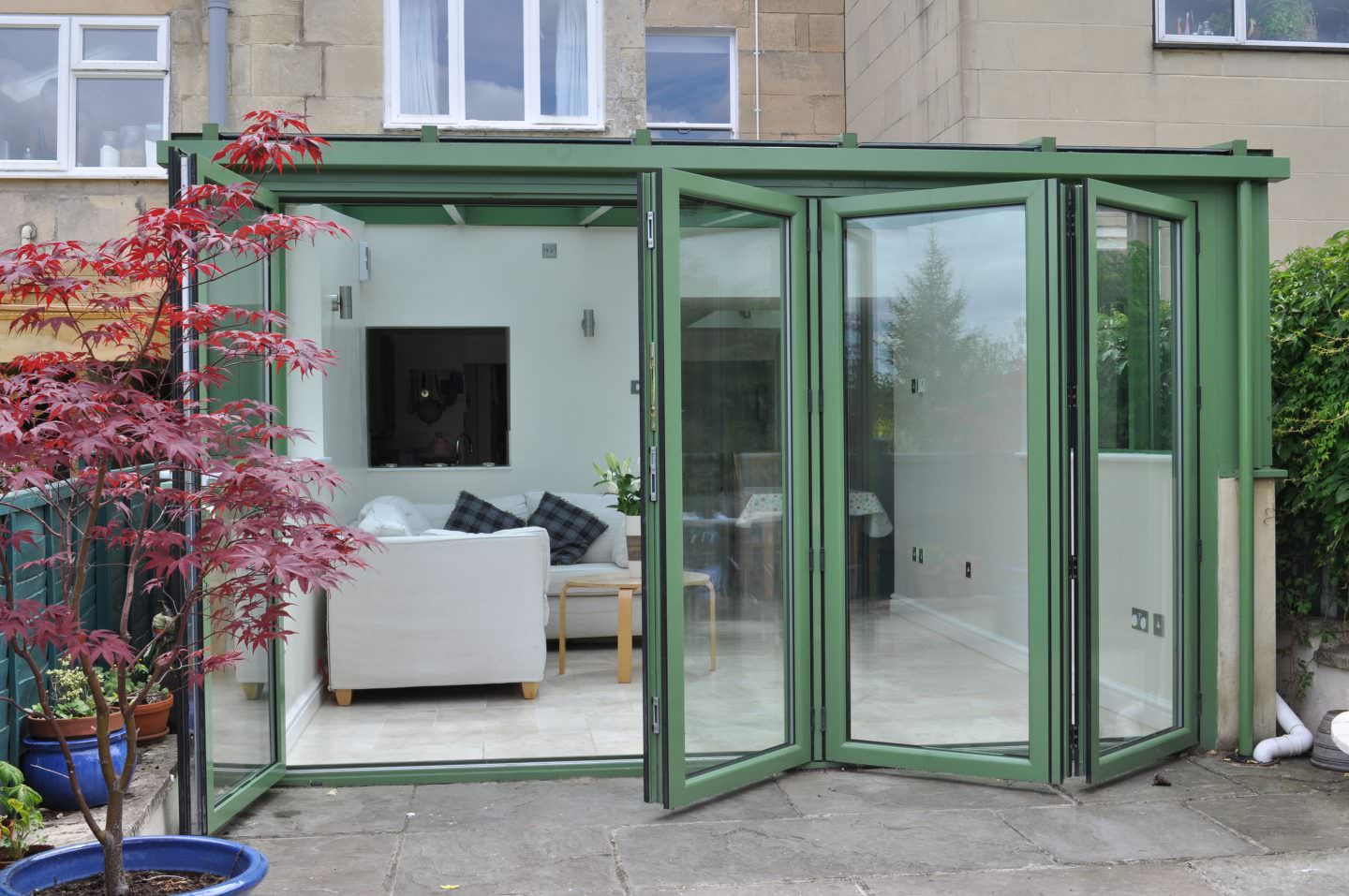 open green Aluminium BiFold Doors
