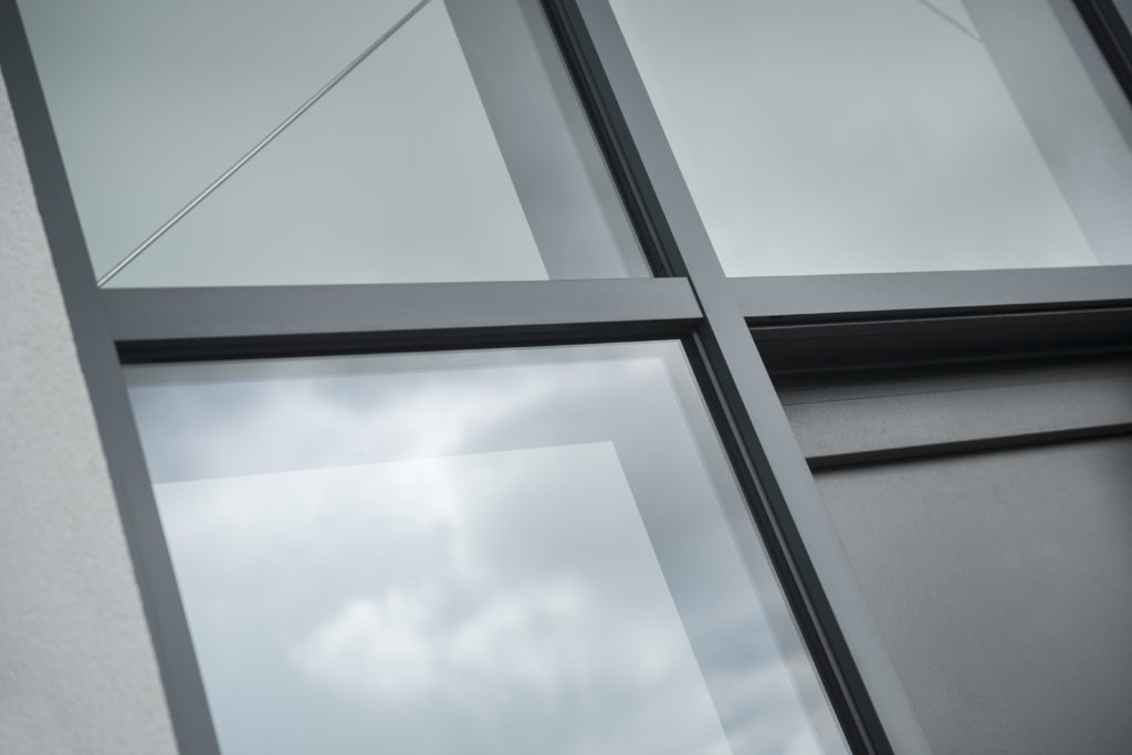 Aluminium Anthracite grey casement windows close up